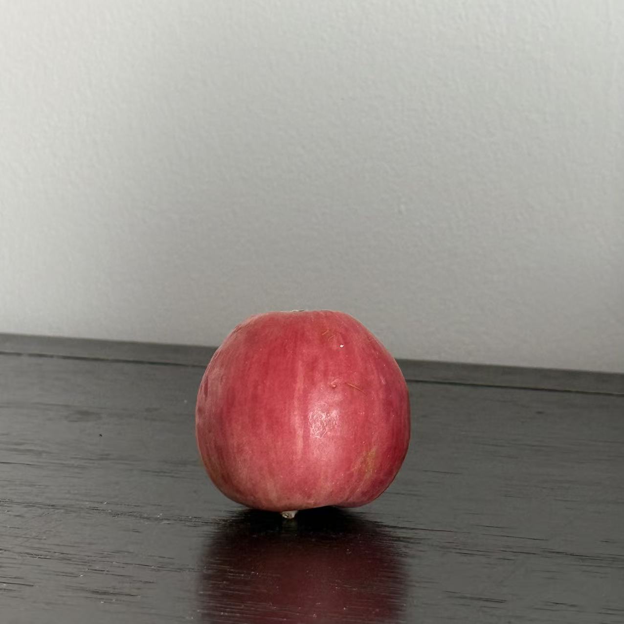 This is an apple, its appearance is sphericity,I chose it because it's the closest thing to a sphere in my home and it's obvious at a glance that it's a sphere.
